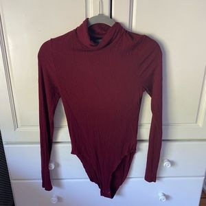 Long sleeve turtle neck body suit.